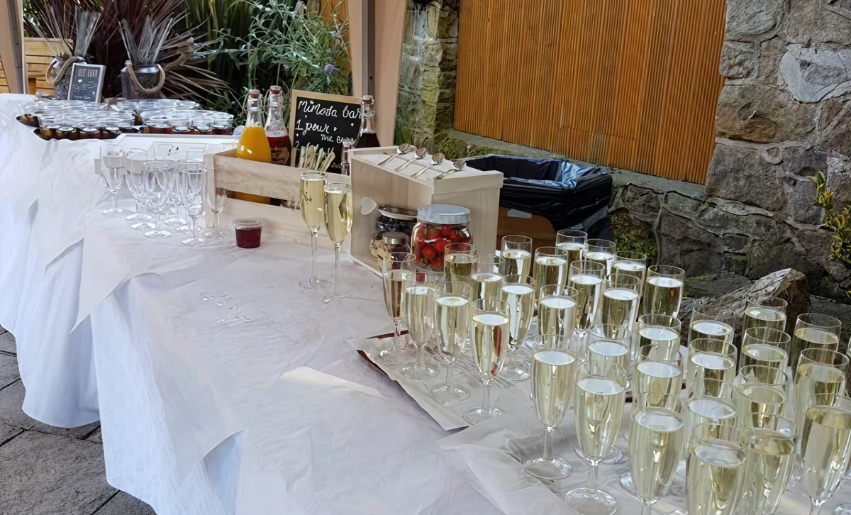 Table with drinks and glasses arranged neatly.